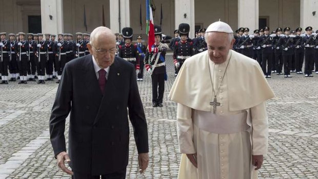 Threat from the "godfathers":  Pope Francis is greeted by Italy's President Giorgio Napolitano as he arrives for a meeting at the Quirinale Palace in Rome.