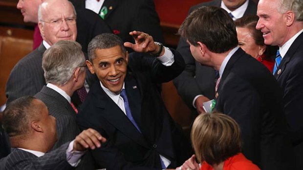 Job done ... US President Barack OBama greets members of Congress after his State of the Union speech.