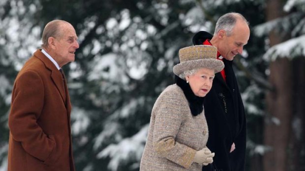 Sixty years and going strong &#8230; the Queen and Prince Philip join a clergyman at the church of St Peter and St Paul at West Newton, eastern England, on Sunday. Photo: AP/Chris Radburn
