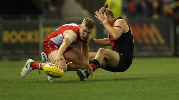 Sydney's Dan Hannebery (right) cannons into Bomber Michael Hurley in the last quarter.