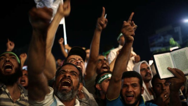 Supporters of Egypt's ousted President Mohammed Mursi chants slogans against Egyptian Defense Minister Gen. Abdel-Fattah el-Sissi at Rabaah al-Adawiya mosque.