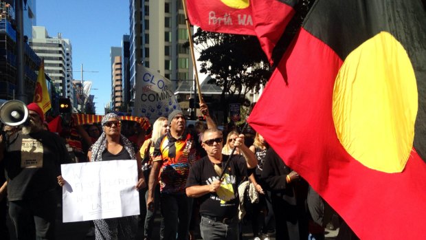 Protesters march in Perth earlier this year against the government's plans to close remote Aboriginal communities.  