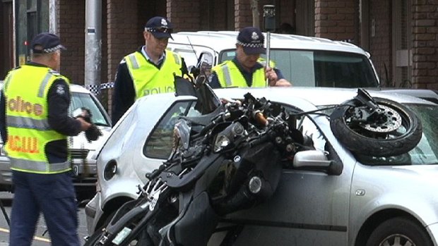 'Life-threatening injuries' ... The motorcycle's front wheel pierced the car's windscreen.