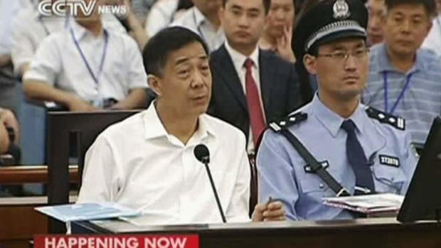 Chinese politician Bo Xilai denied one of the bribery charges against him on as he appeared in public for the first time in more than a year.