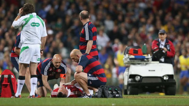 Cian Healy receives attention to an ankle injury.