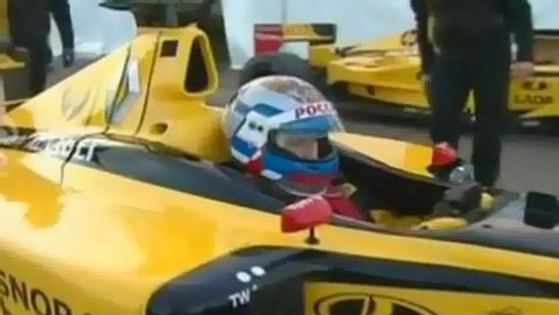 Putin takes Formula One car out for a spin.