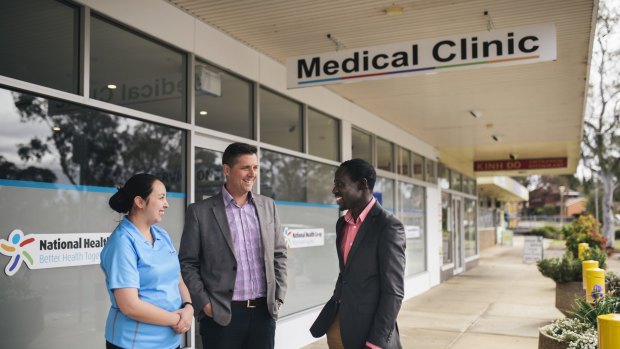 Nurse Kieth Ancheta, director Adrian Watts and medical director Joe Oguns outside the National Health Co-op medcial clinic in Macquarie. 
