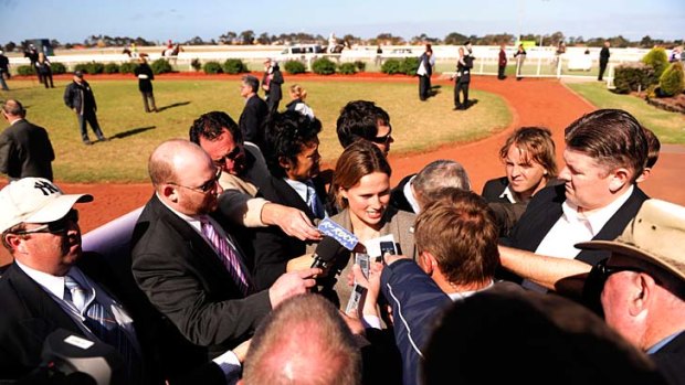 Front and centre: Francesca Cumani is swamped after Bauer's Geelong Cup win.