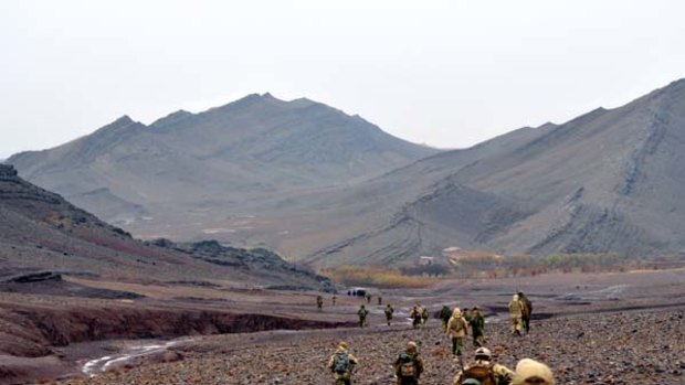 Hearts and minds ... members of Australia's Special Operations Command move through the Garmab Valley, in Oruzgan Province.