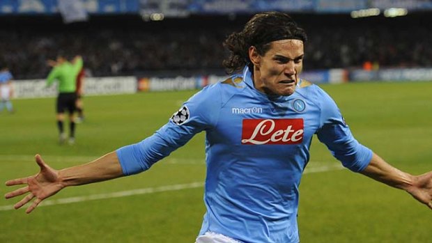 Twinkle toes: Napoli forward Edinson Cavani sinks his boot into Manchester City in the home Champions League match.