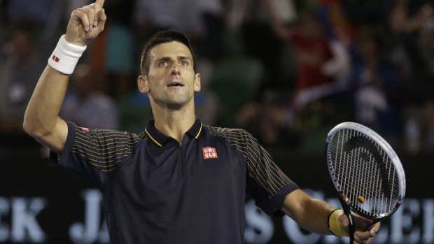 Novak Djokovic celebrates after defeating Stanislas Wawrinka of Switzerland to enter the quarter-finals.