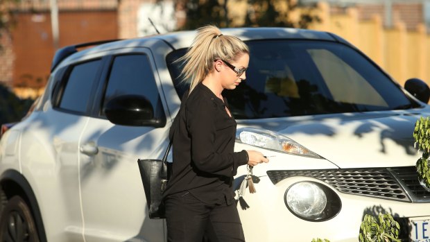 A young woman is seen entering the Ristevskis' home on Tuesday.