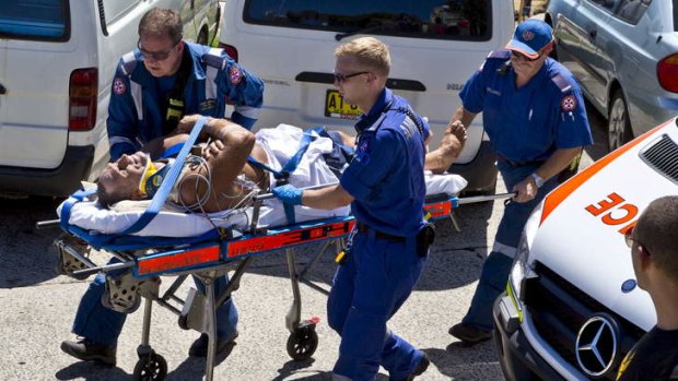 Dimitri Maskovich is rescued after falling five metres onto rocks at Bondi Beach.