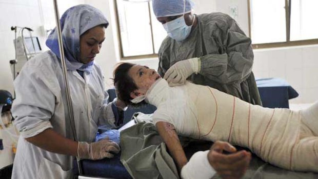 Hanife, 15, has her bandages changed after skin graft surgery at the Herat burns hospital.