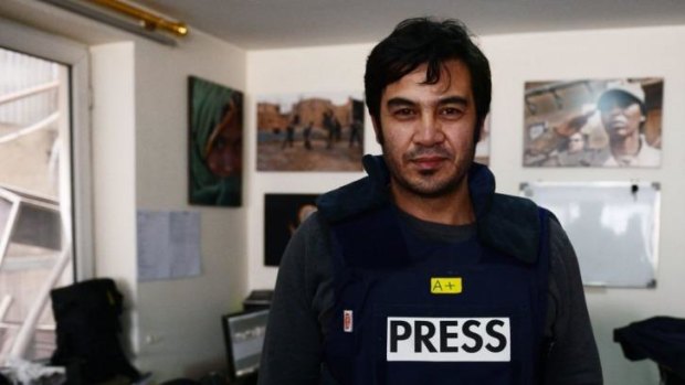 Executed ... Sardar Ahmad, 40, a Kabul-based staff reporter at the Agence France-Presse (AFP) news agency poses for a photo at the AFP office in Kabul hours before he, his wife and two of his three children were gunned down by Taliban gunmen in Kabul's Serena Hotel.