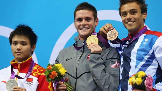 On the podium ... silver medallist Qui Bo of China, gold medallist David Boudia of the United States, and bronze medallist Tom Daley.