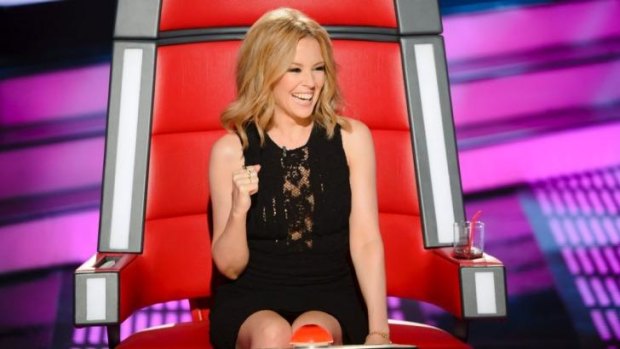 Playful: Kylie Minogue in the judge's chair on The Voice.