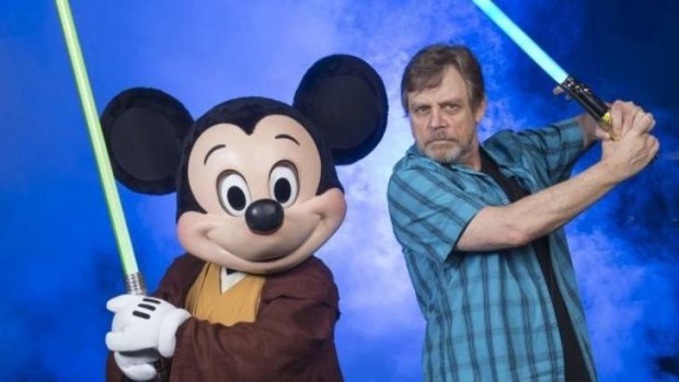 Mickey Mouse and Mark Hamill, the original Luke Skywalker, pose with light sabres to promote a <i>Star Wars</i> weekend at Disney Studios.