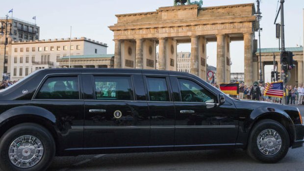 Historic: The motorcade carrying US President Barack Obama and his family passes the Brandenburg Gate after arriving in Berlin on Tuesday.