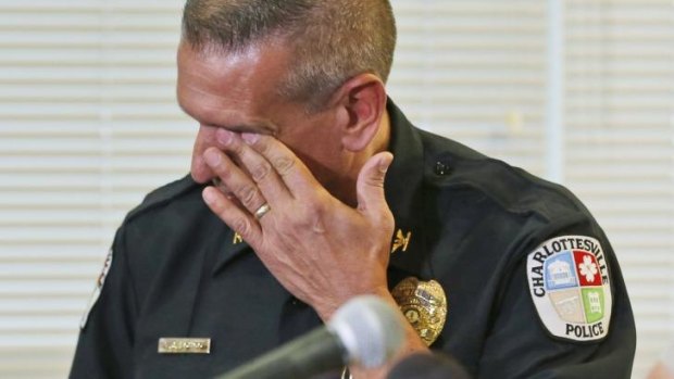 Charlottesville Police Chief, Tim Longo,  wipes his eyes as he and Albermarle County police Col. Steve Sellers, brief the media on the discovery of remains in Albermarle County.