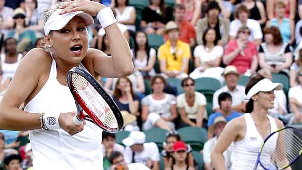 Anna Kournikova reacts during her Ladies Invitation doubles match with alongside Martina Hingis (background).