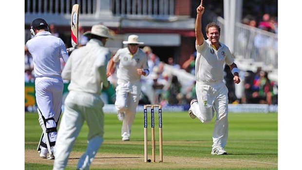 Australia's Ryan Harris (right) celebrates after taking the wicket of England's James Anderson (far left) early on the second day of the second Test match at Lord's.