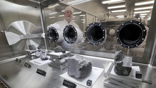 Apollo sample curator Ryan Zeigler with lunar rock specimens.