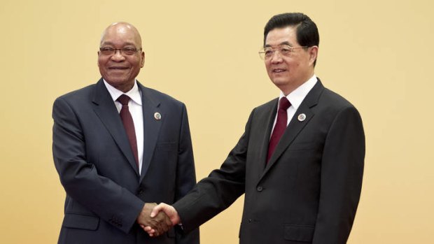 South African President Jacob Zuma, left, shakes hands with Chinese President Hu Jintao.