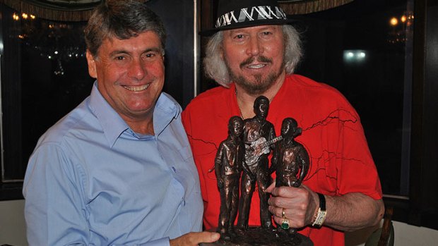 Moreton Bay Mayor Allan Sutherland and Barry Gibb  with a rough miniature of the statue to be unveiled on Thursday.