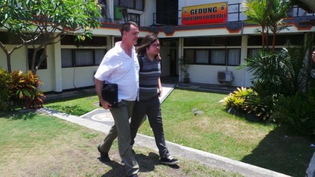 Jon Ellis, son of slain Australian businessman Bob Ellis, arrives at a police station in Bali.