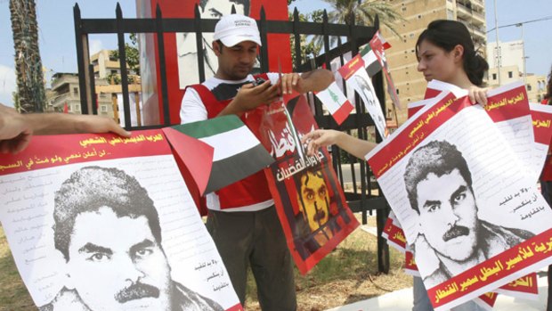 Activists from Lebanon's leftist Popular Democratic Party put up pictures of Samir Quntar in Martyrs' Square in the Lebanese town of Sidon last week.