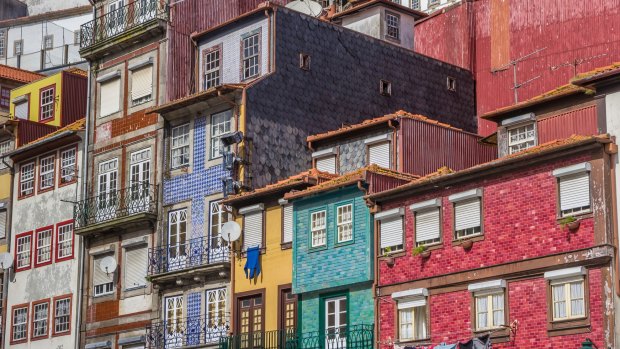 Colourful houses with tiles facades in Porto, Portugal.