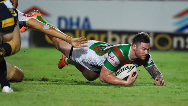 Try time: Chris McQueen scores for Souths against the Cowboys.