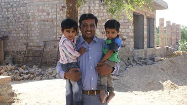 Raviban Bhatti with his two daughters.