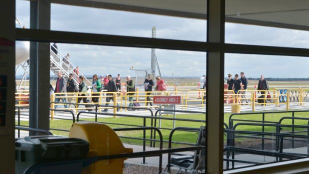 Passengers leave their plane at Avalon airport.