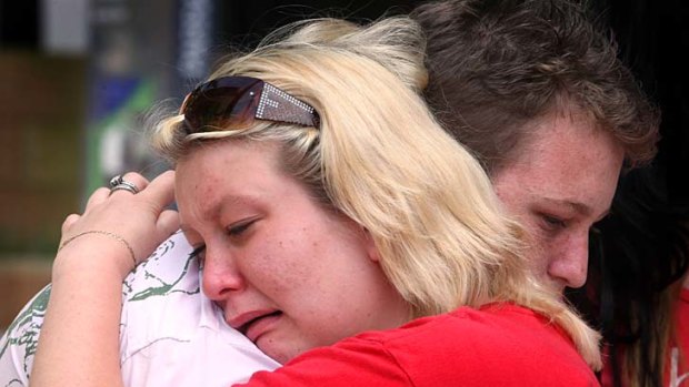 Melissa Ashfield is comforted after Austin Allan Hughes was granted parole. Now her mother is set to be released.