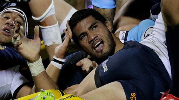 Handy effort . . . Sitaleki Timani signals his match-winning try for the Waratahs against the ACT.
