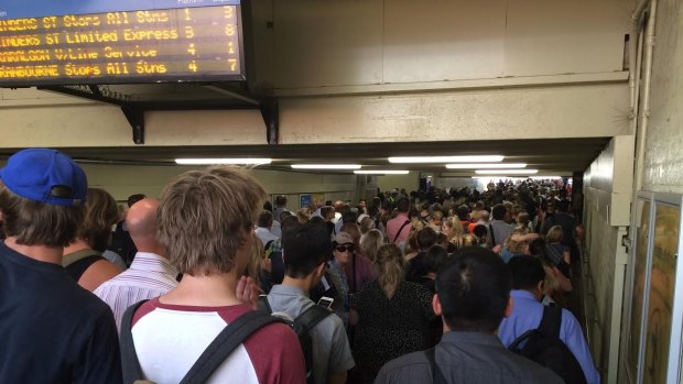 Crowds at Caulfield station wait for replacement buses following a train disruption on the Frankston line.