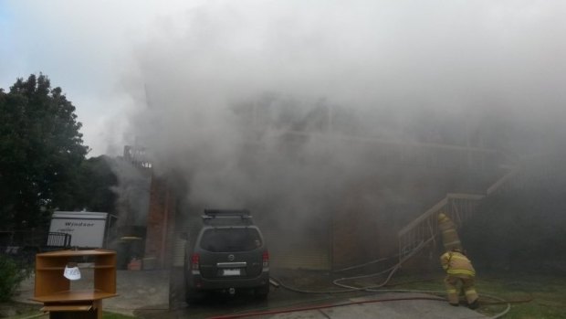 Smoke fills Triumph Court, Highton, as an "aggressive fire destroys the brick home. 