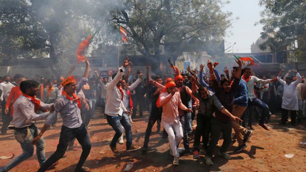 Dancing in the streets after the Bharatiya Janata Party triumphed in  the Uttar Pradesh state legislature election.
