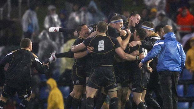 Triumph ... Scotland celebrates after the full-time whistle.