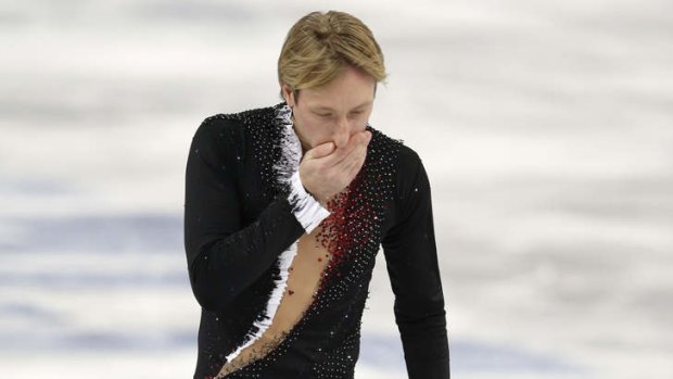 End of a career ... Russian Evgeni Plushenko leaves the ice after pulling out of the men's short program figure skating competition due to injury at the Iceberg Skating Palace.
