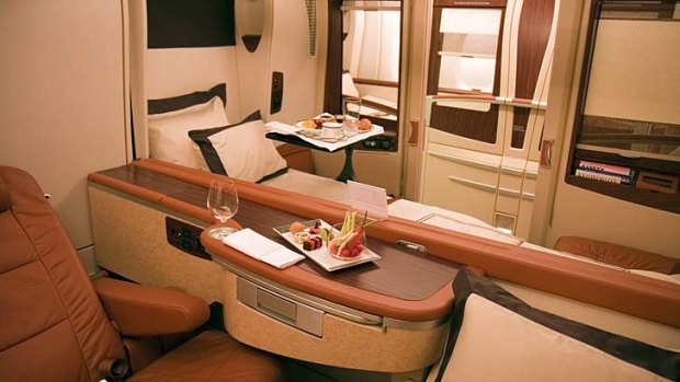 The current first class cabin on Singapore Airlines' A380 superjumbos features private suites. The new seat designs can be retrofitted on to the A380s, the airline says.