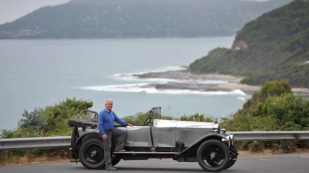 Peter Latreille with his vintage car on the Great Ocean Road.