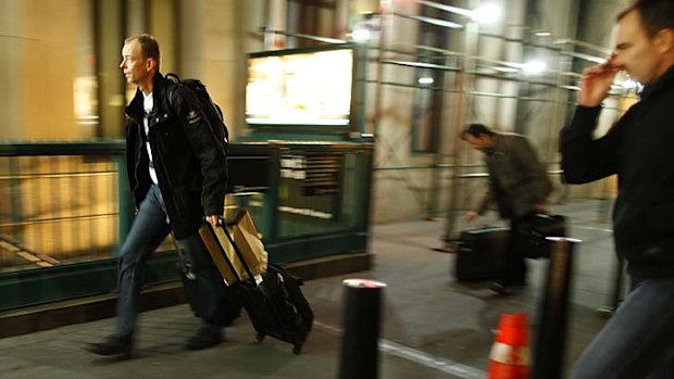 People make their way to the Wall Street station, to get out of lower Manhattan.