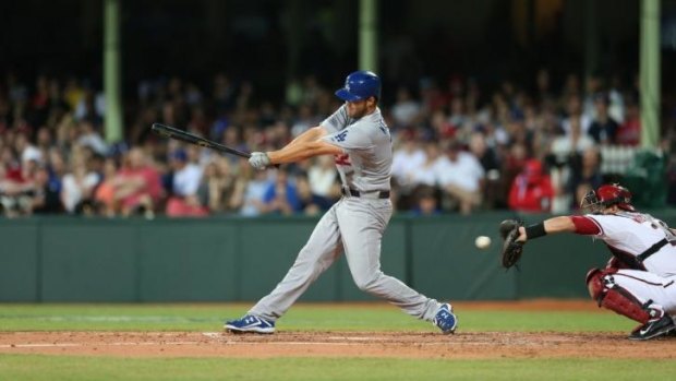 Clayton Kershaw swings and misses for the LA Dodgers in their clash with Arizonat Diamondbacks at the SCG in March.