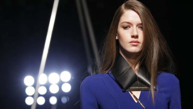A model presents a creation by French designer Roland Mouret.
