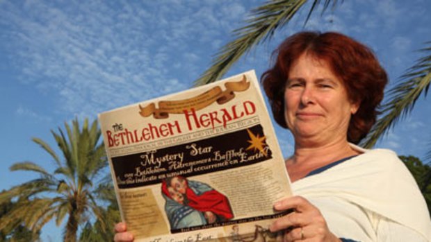 Amateur Israeli historian Sarit Gani, with a copy of <i>The Bethlehem Herald</i> she produced.