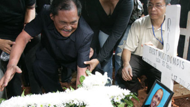 Destroyed ... Vikto Mocodumpis at his son's grave.