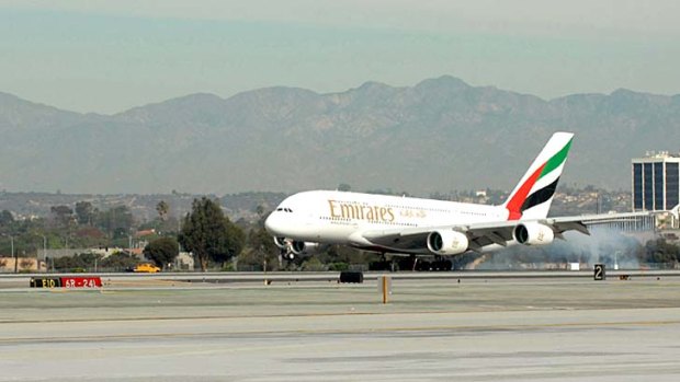 An Emirates A380 touches down in Los Angeles after its first flight from Dubai, a 16-hour, 20-minute long-haul.